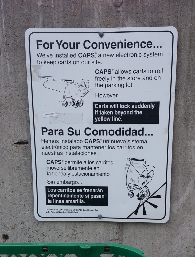 sign explaining that your shopping cart will lock its wheels if you try to take it too far