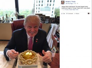 Trump eating out of a bagel and honey bowl